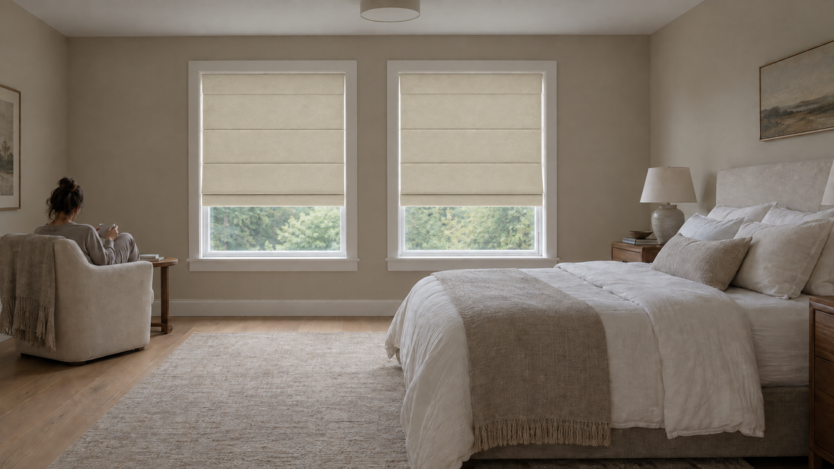 Blackout Roman Shades in Ivory — a primary (master) bedroom suite in a settled suburban house, early morning under soft overcast light