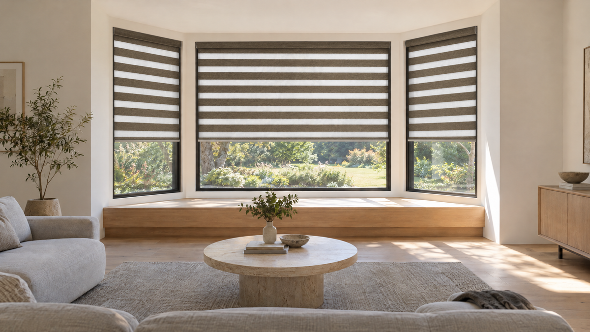 Zebra Shades in Bronze — a modern living room built around a three-panel angled bay window