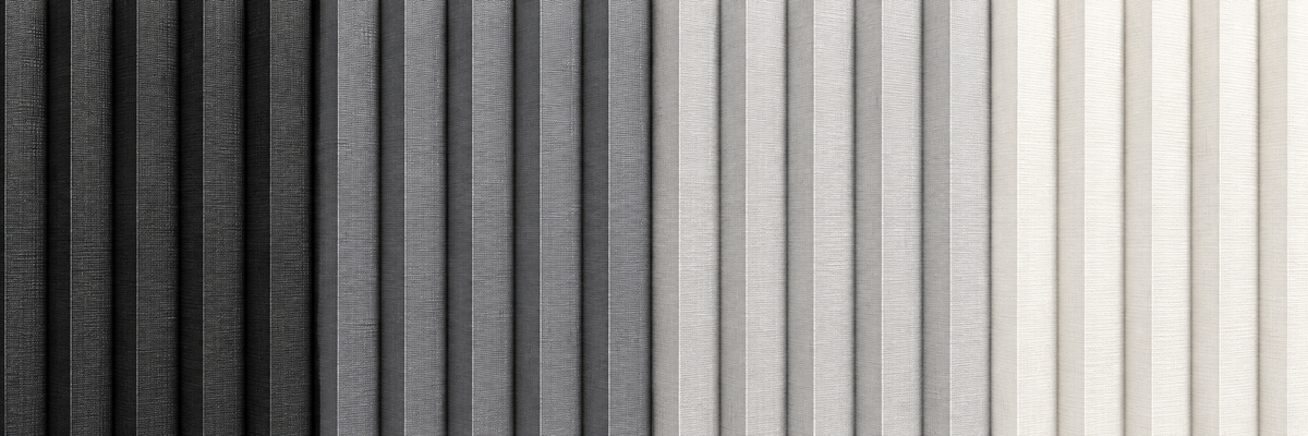 A close-up swatch of vertically textured material showing a gradient from black on the left through gray to off-white on the right.